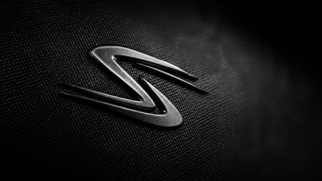 Create a high-resolution cinematic macro brand image of the STRYDR logo mark. use logo from the shoe