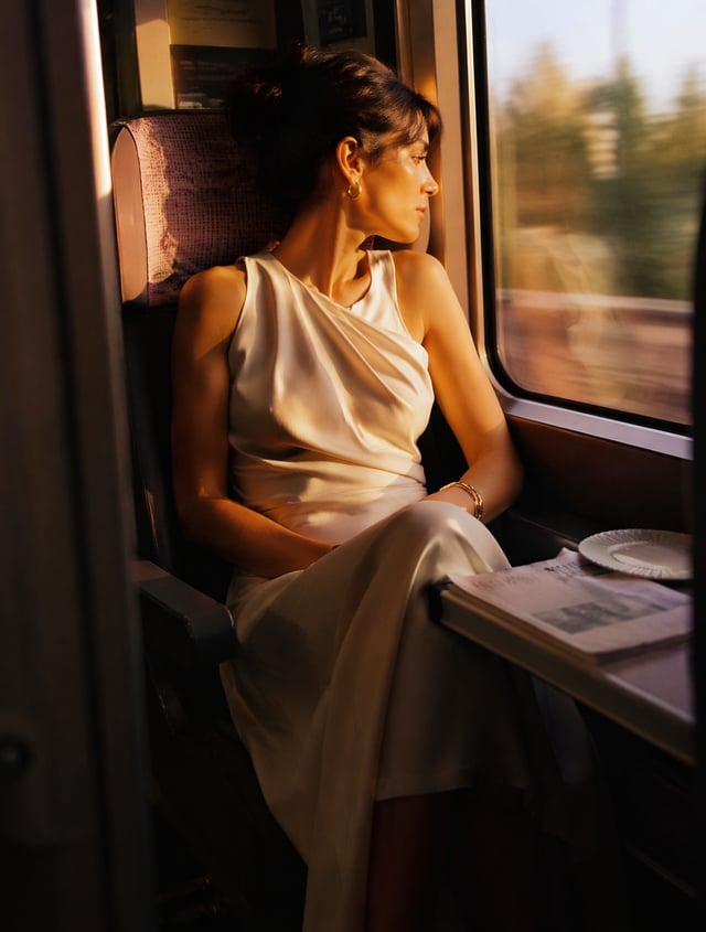 Ultra-realistic cinematic fashion photography of a beautiful woman.Wearing a sophisticated designer 