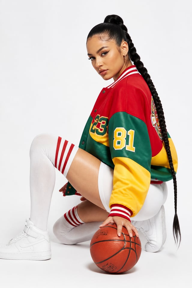 { "subject": { "description": "A young woman with a focused, confident expression and a sleek high-b