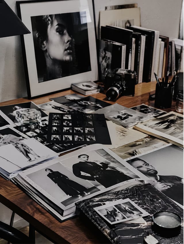 Fashion editor's workspace, magazine layouts, film photographs, creative publishing atmosphere, luxu