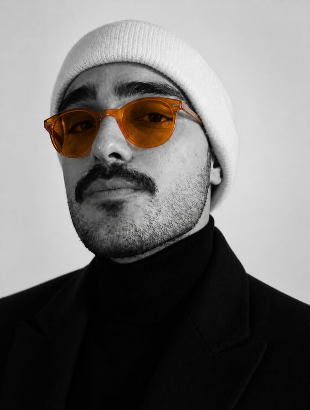 Ultra-realistic studio portrait of a man, close-up headshot, centered composition, neutral expressio