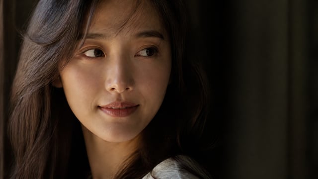 cinematic close-up portrait, shot on 85mm f1.8 lens, shallow depth of field, young east asian woman,