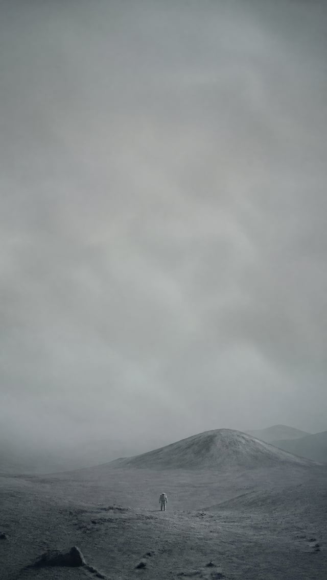 登陆月球，9:16 电影感风景构图，画面中上方65%为大面积留白，超广角镜头，极远景，一个极小的孤独人物位于画面下方居中，人物高度小于画面5%，人与自然形成巨大尺度对比，极简构图，深远空间透视，前景、