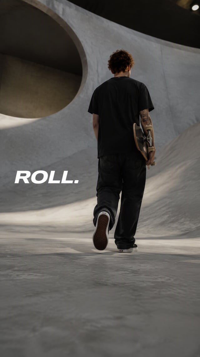 Premium editorial campaign.Main Subject: Young man walking through an indoor skatepark.Creative Dire