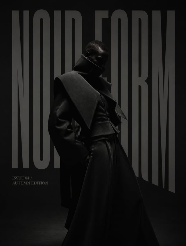 High-fashion editorial portrait inside an enormous brutalist black studio, model wearing an avant-ga