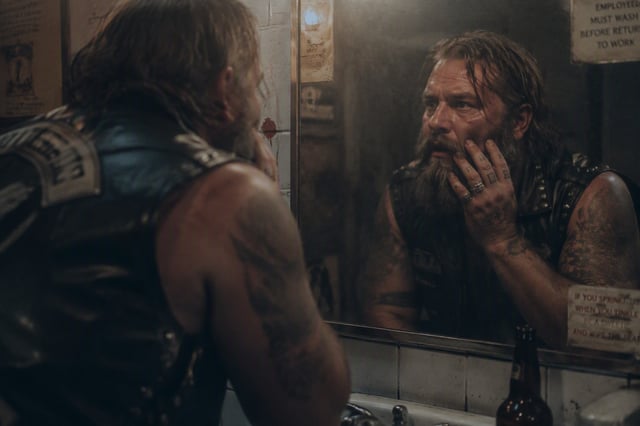 HideIn the grimy restroom of a roadside diner at midnight, a burly biker in a sleeveless studded lea