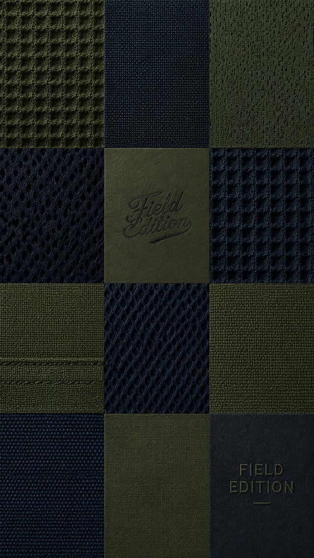 A highly textured wallpaper. A precise grid of different close-up textile textures (waffle-knit cott