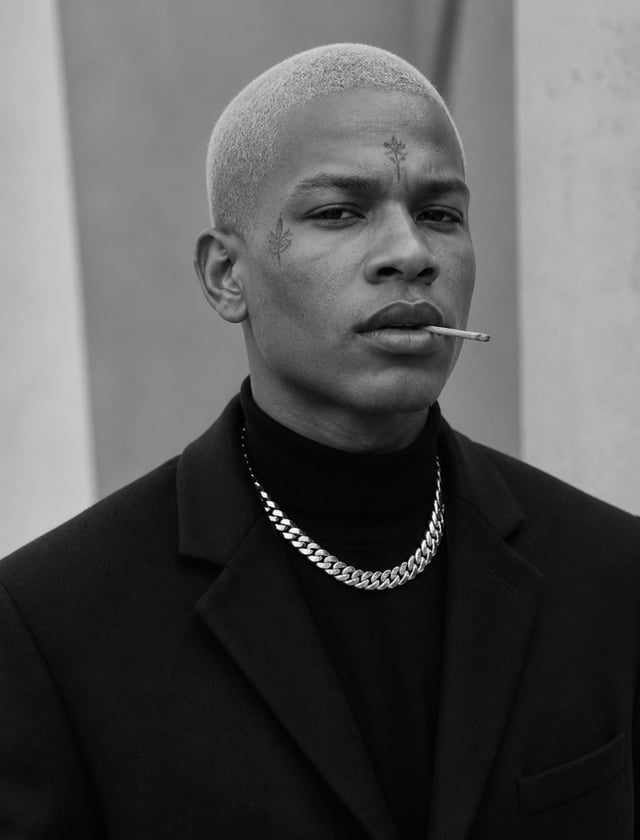 Ultra-realistic fashion black and white portrait of a man with short light hair buzzcut white hair ,