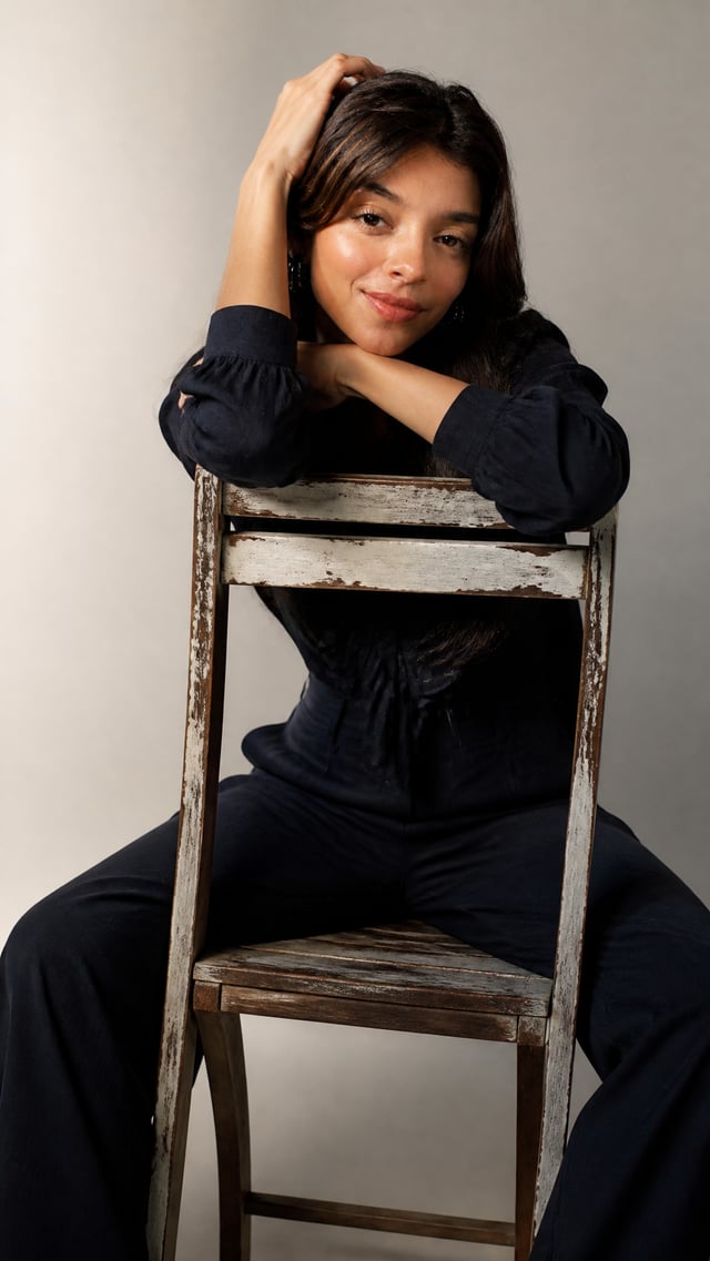 Create a restrained studio fashion portrait with an exact vertical aspect ratio of 736:981 in a full