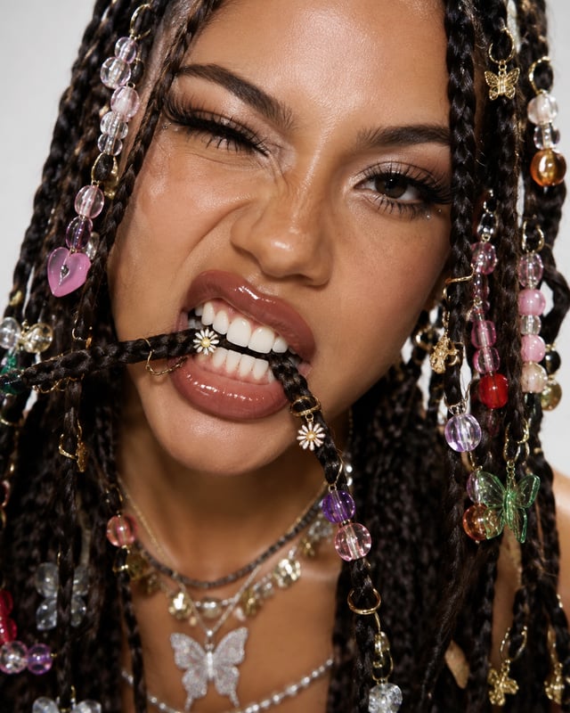 ultra realistic extreme close-up beauty portrait of a woman with multiple thin braids decorated with