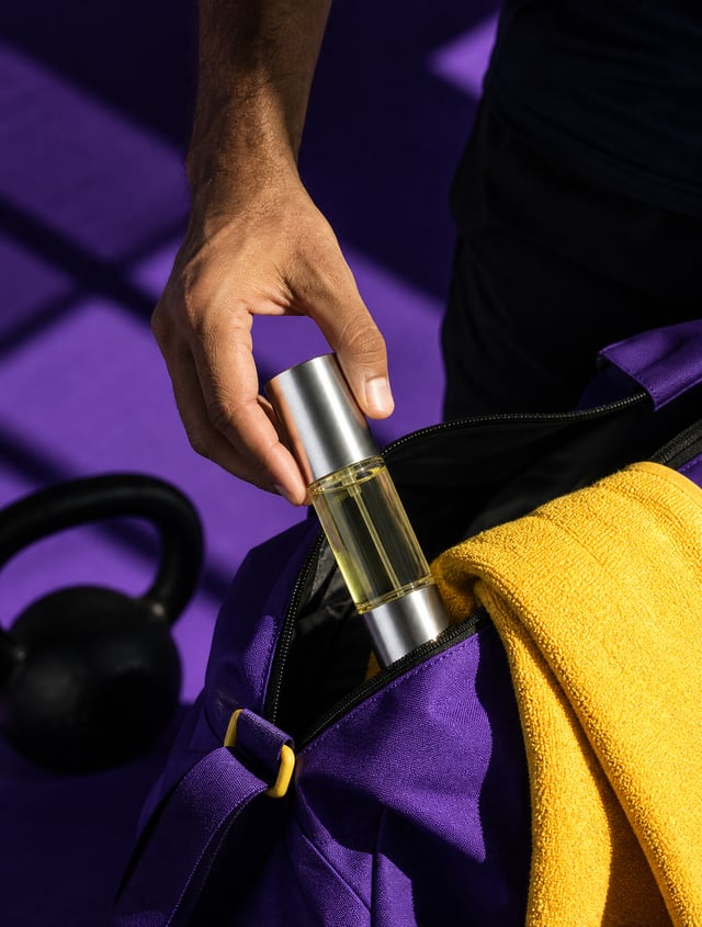 Premium lifestyle beauty photography. A man places product @img1 into a gym bag after a workout. Dee