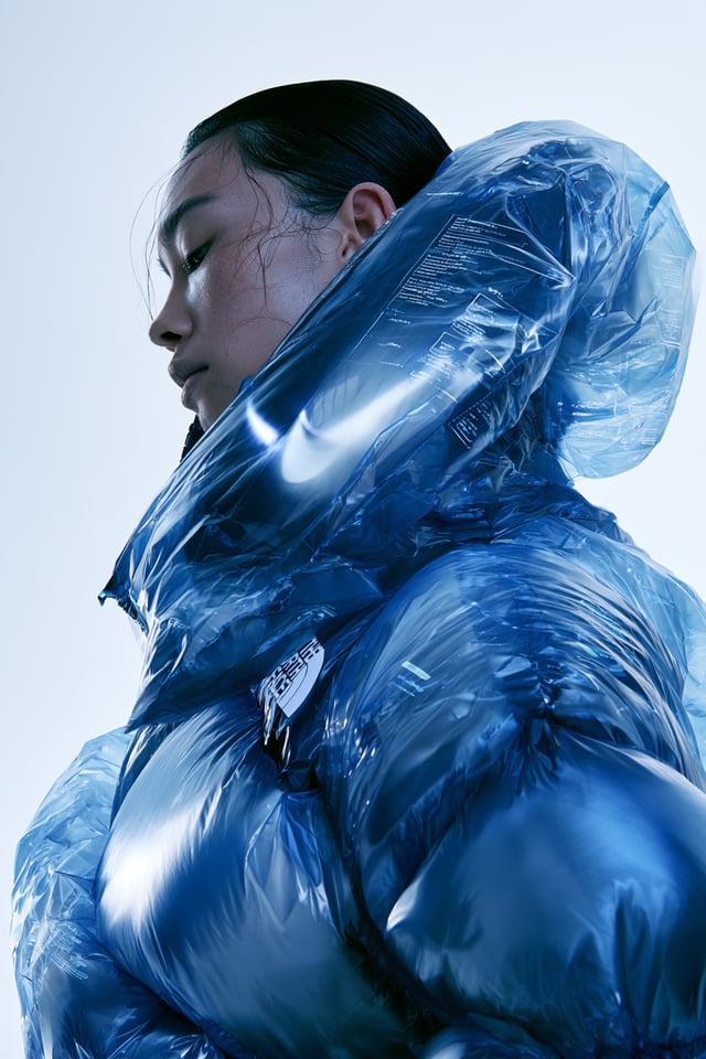 Subject & Action\nA high-fashion editorial portrait of a model in profile, wearing an oversized, ava