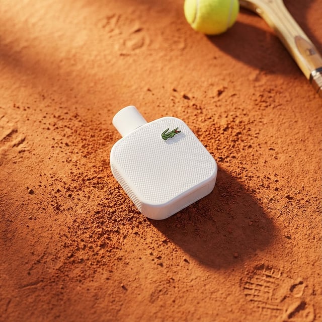 A high-end editorial photo of a [PRODUCT] placed flat on a [TEXTURED SURFACE], captured from a direc