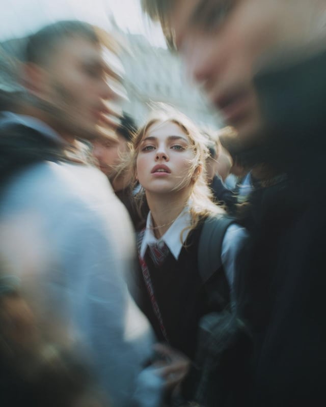 Paparazzi-style extreme close-up photo of a woman with striking facial features, caught off-guard wh