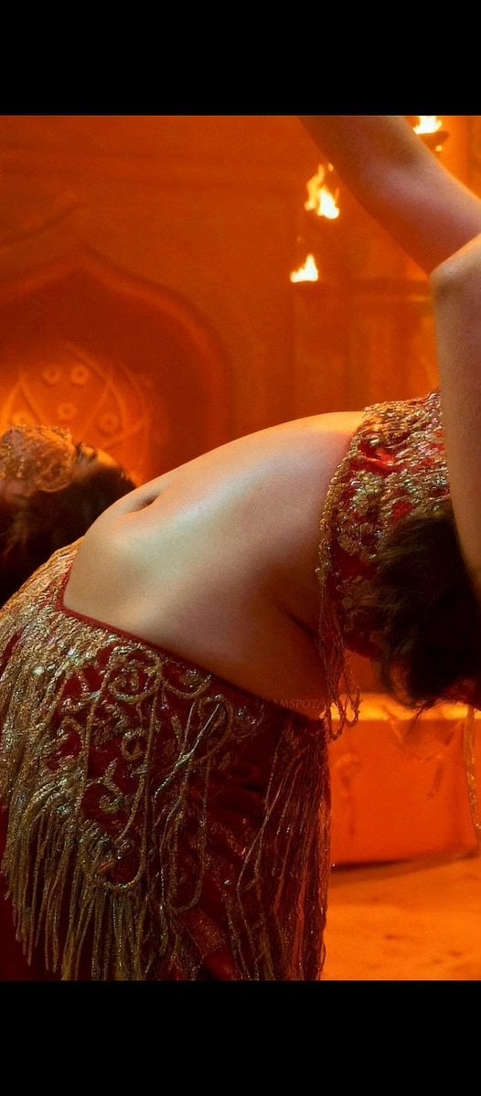 A close-up, high-fashion cinematic portrait of a beautiful South Asian woman with defined features, 