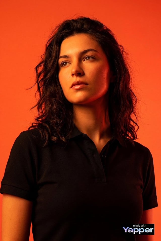 Create a high-impact editorial studio portrait using the person from the attached reference photo as