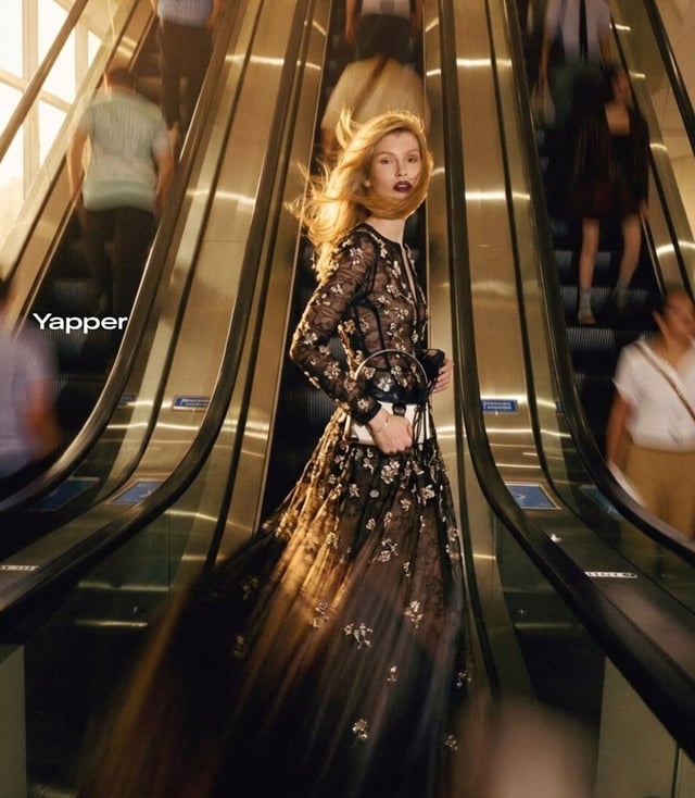 Ultra-realistic cinematic fashion photograph of a stylish blonde woman standing confidently between 