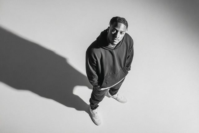 A [subject] photographed from a 35-degree overhead angle, standing alone in an off-white studio void