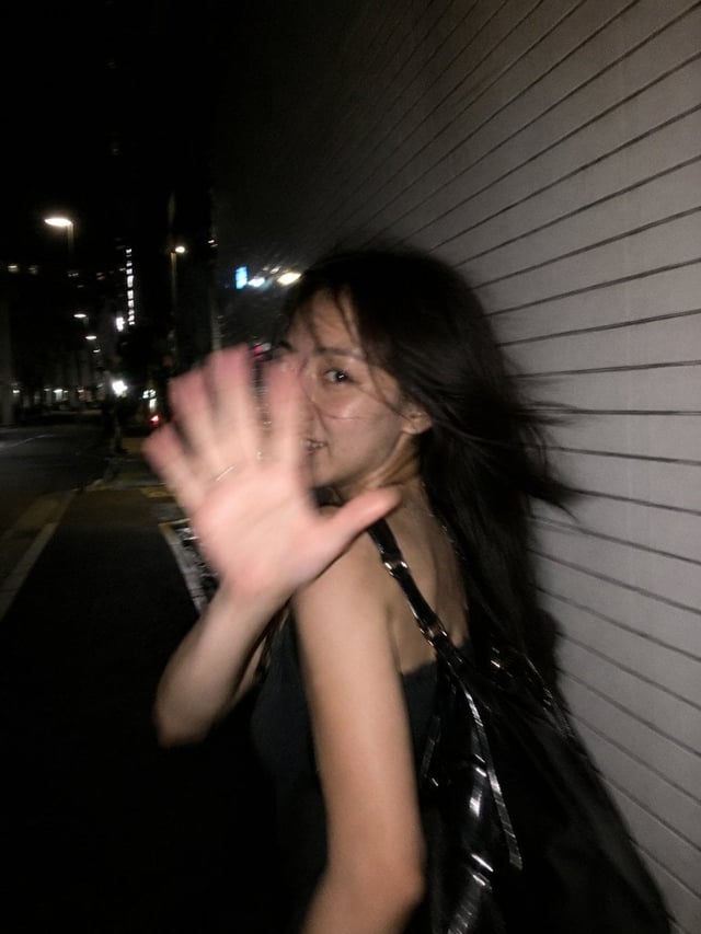 Ultra-realistic candid smartphone flash photograph, portrait orientation, 3:4 aspect ratio. A young 