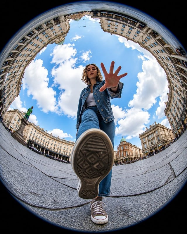 Ultra-realistic action photography, extreme fisheye lens, 8mm, worm’s-eye view from ground level, dy