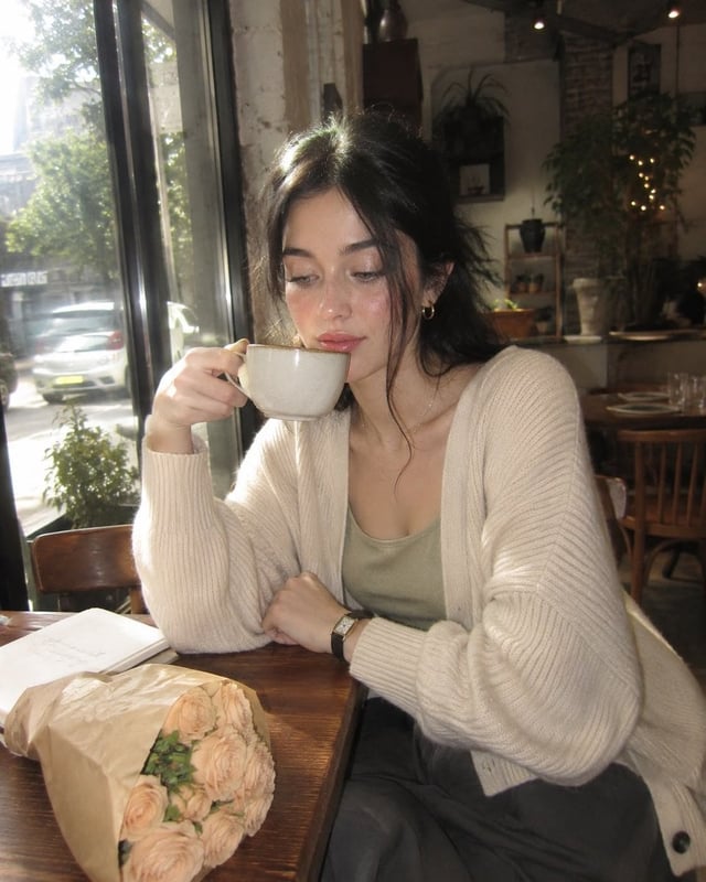 Create an ultra-realistic nostalgic café portrait captured on a premium early-2000s compact digital 