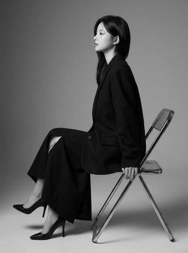 Create a highly realistic 8K professional black-and-white fashion editorial portrait of a Korean Eas