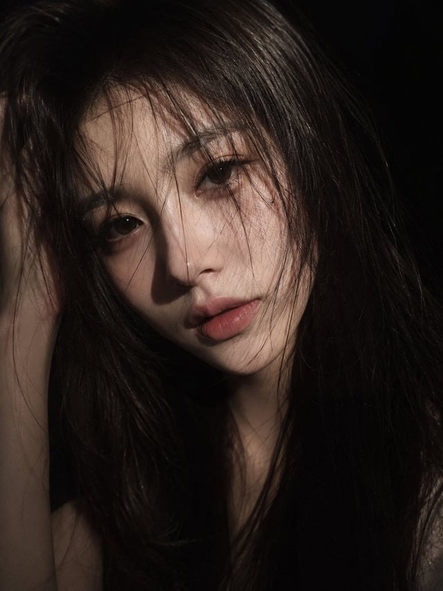 an ultra-realistic cinematic close-up portrait of a young East Asian woman. She has long, slightly t