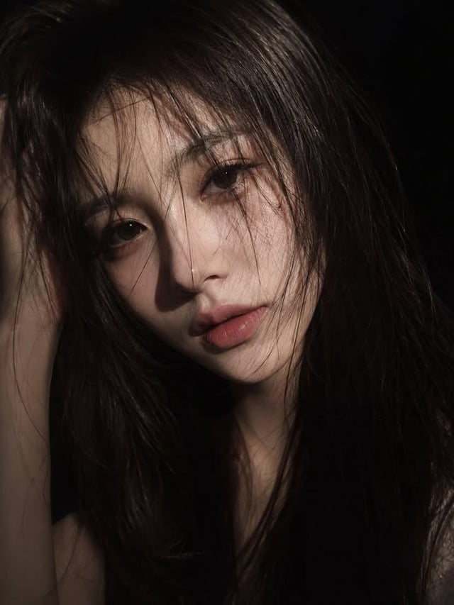 ultra-realistic close-up portrait of a beautiful young woman with long straight dark hair, messy str