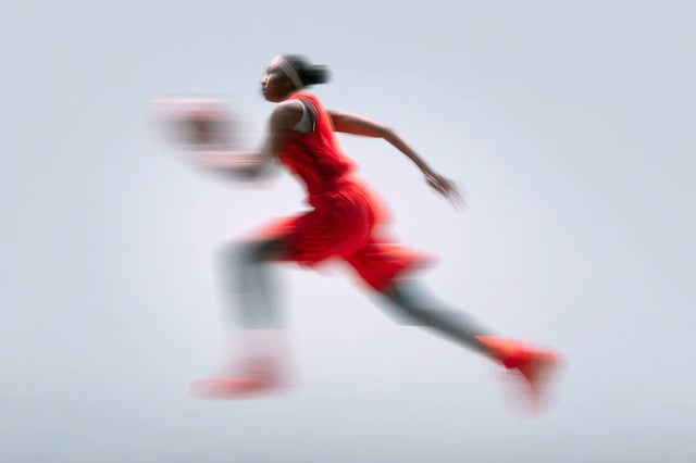 A blurred silhouette of a [Subject] in motion, wearing a [Color] sports kit, captured with a slow sh