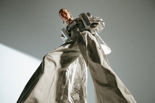 A [Subject] photographed from an extreme low-angle ground-level view, camera positioned near the flo